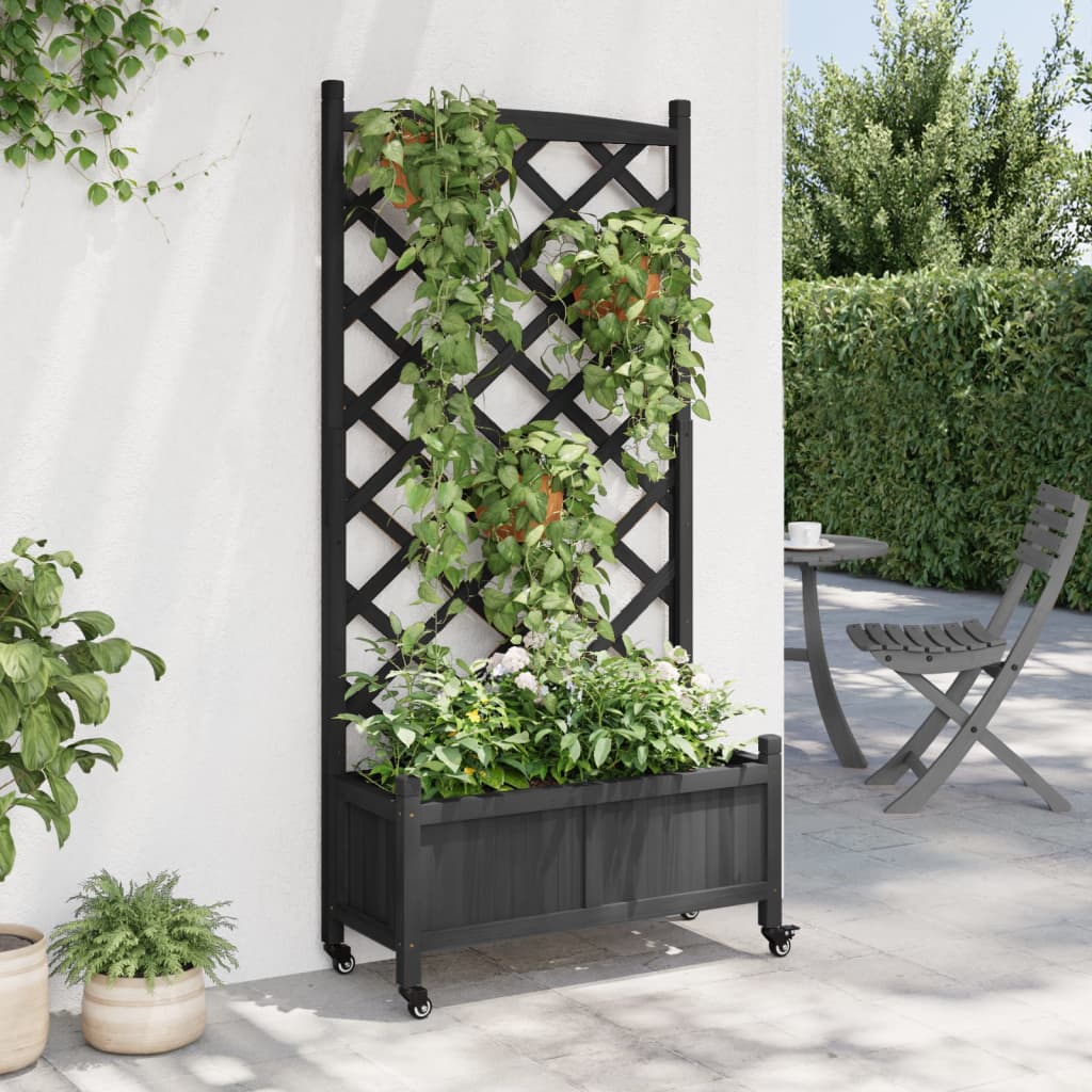 vidaXL Jardinera con enrejado y ruedas madera maciza de abeto negro