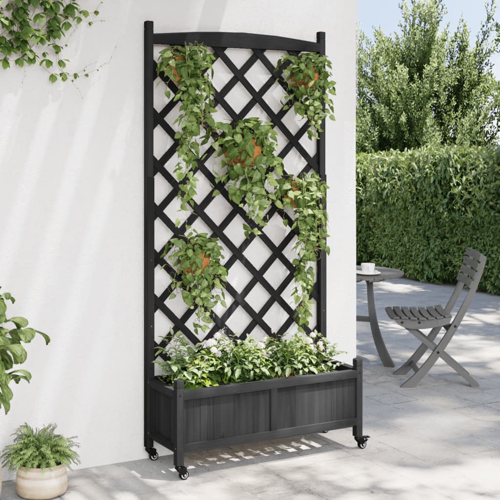 vidaXL Jardinera con enrejado y ruedas madera maciza de abeto negro