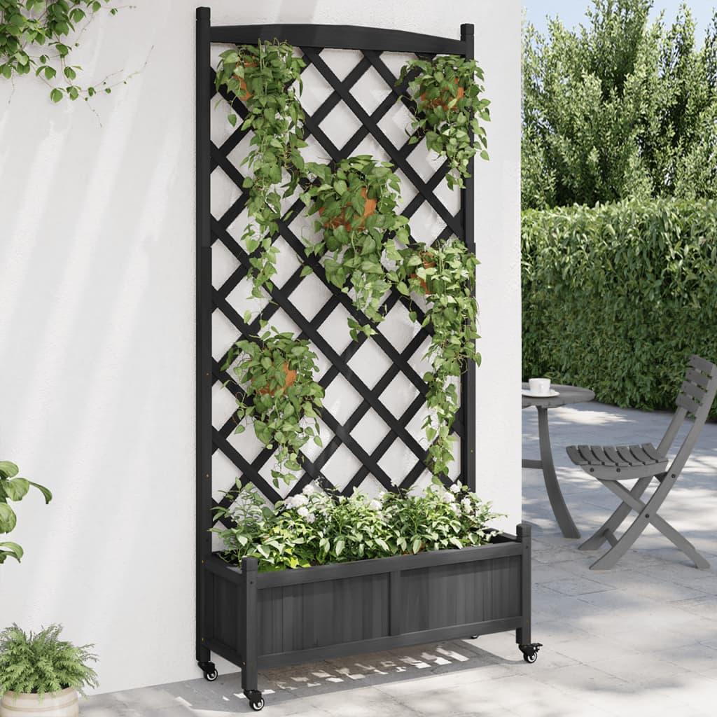 vidaXL Jardinera con enrejado y ruedas madera maciza de abeto negro